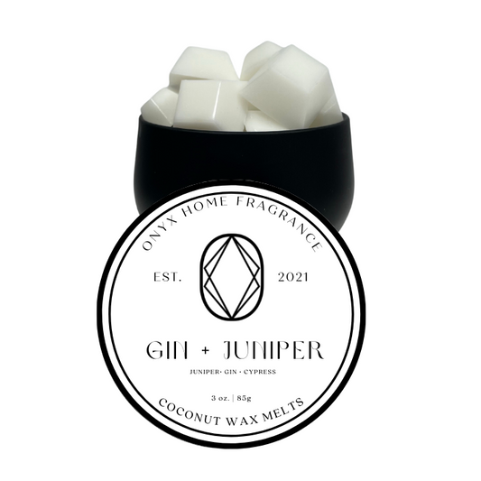 Black tin with gem shaped wax melts. Gin & Juniper scented.