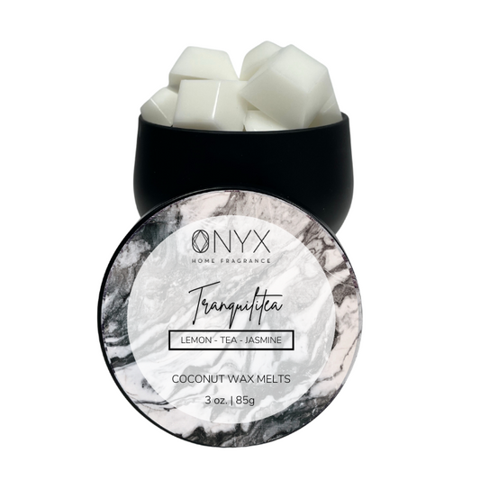 Black tin with gem shaped wax melts. Tranquilitea scented.